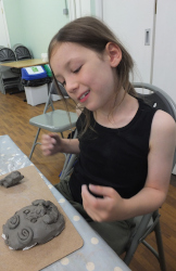 making pottery faces