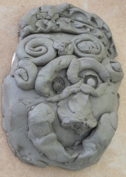 making pottery faces