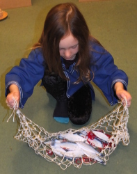 pretending to fish with a net