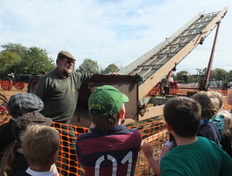 looking at a bale stacking machine